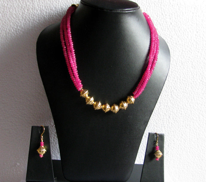 Gold finished fillers and pink stones Necklace set