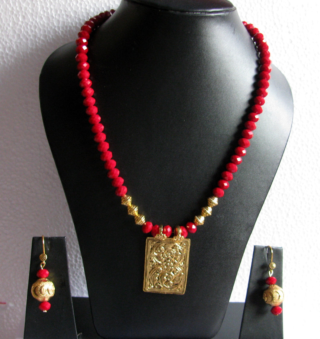 Red Necklace with crystals and oxidized pendant and earrings.